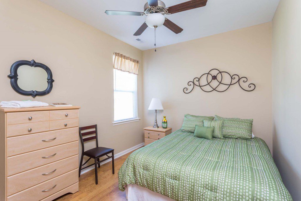 Private bedroom with hardwood floors and natural light at Avendelle at Lazy River